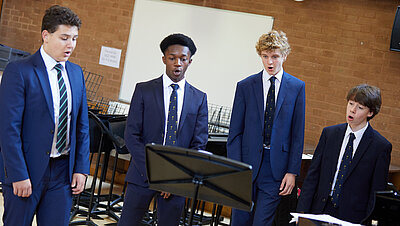 Four pupils singing in Recital Hall
